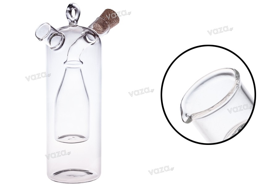 Flacon de sticlă cu "două compartimente" împreună cu 2 dopuri conice din plută naturală și cu inel de agăţat. Lucrare manual din sticlă suflată