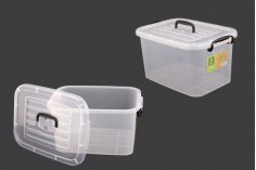 Boîte de rangement aux dimensions 345 x 240 x 185 mm en plastique, transparente, avec poignée et fermeture de sécurité.