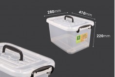 Boîte de rangement aux dimensions 410 x 280 x 220 mm en plastique, transparente, avec poignée et fermeture de sécurité.