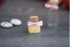 Polka dot pre-tied bows to decorate wedding and christening favors, jars and bottles