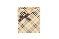 Beige checkered paper gift bag with ribbon bow tie and cotton rope handle in size 140x70x150 mm