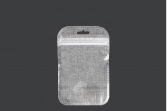 Non-woven zip lock bags with Eurohole, silver back side and transparent front side in size 85x130 mm - 100 pcs