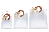 Gift bag plastic 160x80x185 mm semi transparent with bow and handle in leather texture - 12 pcs Gift bag plastic 160x80x185 mm semi transparent with bow and handle in leather texture - 12 pcs