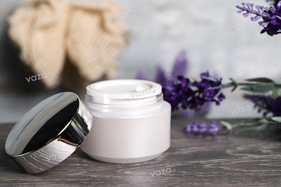 Acrylic 50ml pearl white cream jar with shiny silver cap, sealing disc and EPE liner inserted in the cap. 