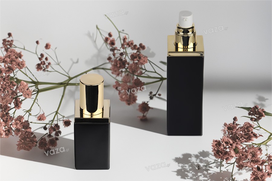 Luxury 40 ml glass bottle in black matte color with gold cap and cream pump