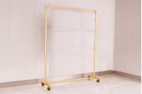 Metal floor stand 120x40x135 cm in gold color with wheels for hangers