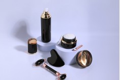 Luxury 40 ml glass bottle in black color with cream pump and acrylic cap