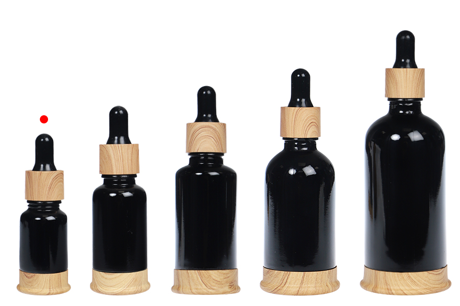 Shishe qelqi 10 ml e zezë me pikatore plastike dhe bazë në dizajn druri-bildgruppe