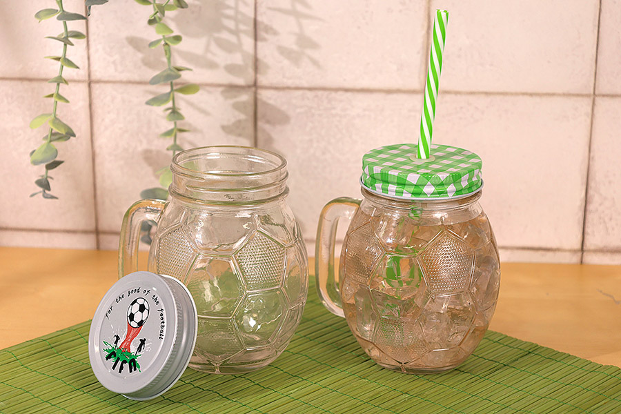 Glass Jar 450 ml football shaped 126x94 mm with silver cap Glass Jar 450 ml football shaped 126x94 mm with silver cap