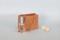 Kraft paper gift bag with a 5 mm rope handle in size 144x60x110 Kraft paper gift bag with a 5 mm rope handle in size 144x60x110