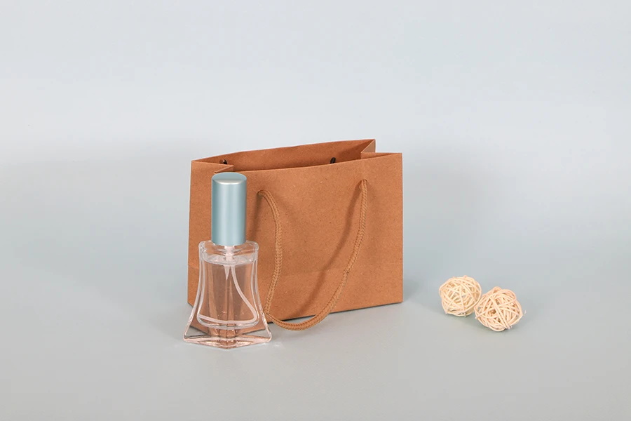 Kraft paper gift bag with a 5 mm rope handle in size 144x60x110 Kraft paper gift bag with a 5 mm rope handle in size 144x60x110