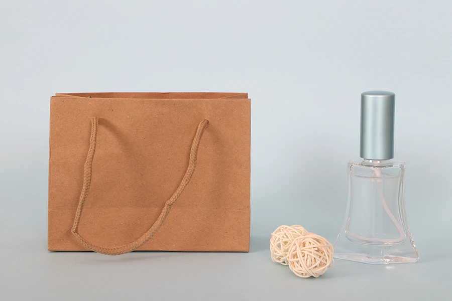 Kraft paper gift bag with a 5 mm rope handle in size 144x60x110 Kraft paper gift bag with a 5 mm rope handle in size 144x60x110