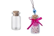 Mini clear glass bottles with cork stoppers, can be used as a wedding or christening favor