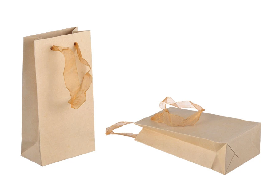 Laminated paper gift bag with a 2 cm sheer organza ribbon handle in different colour shades Laminated paper gift bag with a 2 cm sheer organza ribbon handle in different colour shades