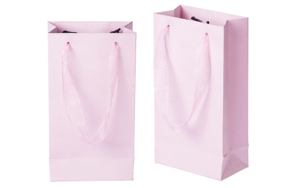 Laminated paper gift bag with a 2 cm sheer organza ribbon handle in different colour shades Laminated paper gift bag with a 2 cm sheer organza ribbon handle in different colour shades