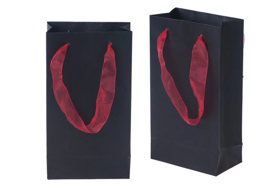 Laminated paper gift bag with a 2 cm sheer organza ribbon handle in different colour shades Laminated paper gift bag with a 2 cm sheer organza ribbon handle in different colour shades
