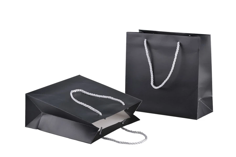 Black laminated gift bag with silver twisted rope handle in size 220x90x210 Black laminated gift bag with silver twisted rope handle in size 220x90x210