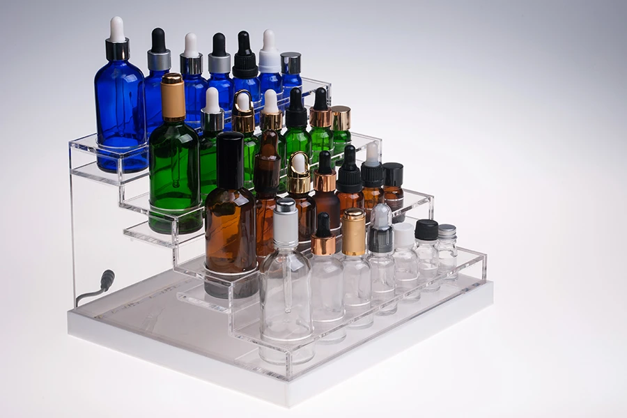 Σταντ (stand) plexiglass φωτιζόμενο με ταινία LED για μπουκαλάκια αιθέριων ελαίων διαφόρων χωρητικοτήτων και βάση λευκή ή μαύρη  - 28 θέσεων