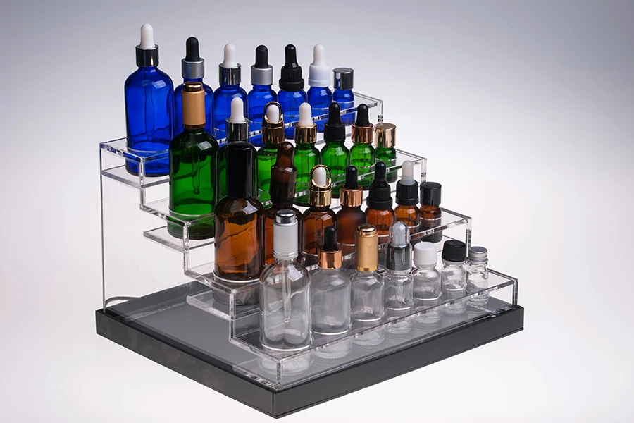 Σταντ (stand) plexiglass φωτιζόμενο με ταινία LED για μπουκαλάκια αιθέριων ελαίων διαφόρων χωρητικοτήτων και βάση λευκή ή μαύρη  - 28 θέσεων