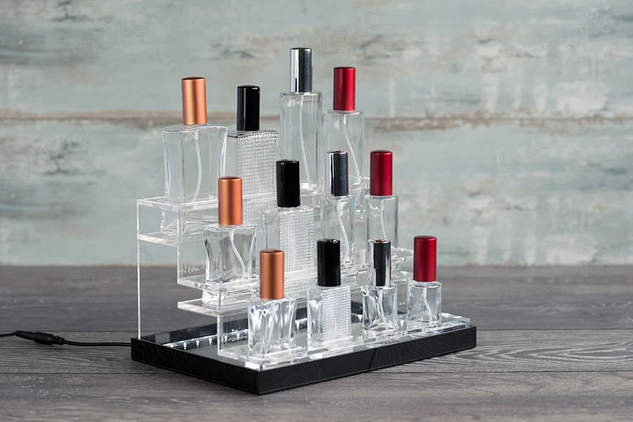 Stand made of plexiglass, with LED lit tape for perfume bottles of various shapes, white or black base - for 12 bottles-εικόνα_σύνθεση