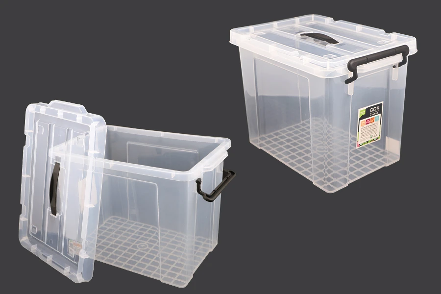 Boîte de rangement aux dimensions 440 x 300 x 325 mm en plastique, transparente avec poignée et fermeture de sécurité