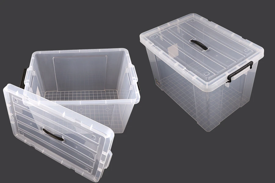 Boîte de rangement aux dimensions 640 x 430 x 400 mm en plastique, transparente avec poignée et fermeture de sécurité