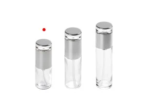 Bottiglietta da 30 ml in vetro trasparente con pompa in color argento e tappo.-3