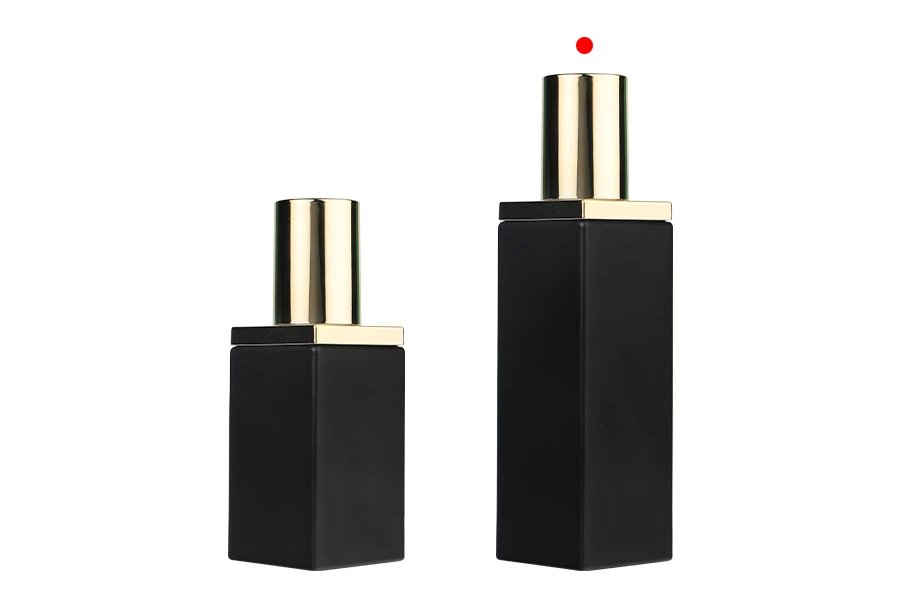 Luxury 100 ml glass bottle in black matte color with gold cap and cream pump Luxury 100 ml glass bottle in black matte color with gold cap and cream pump
