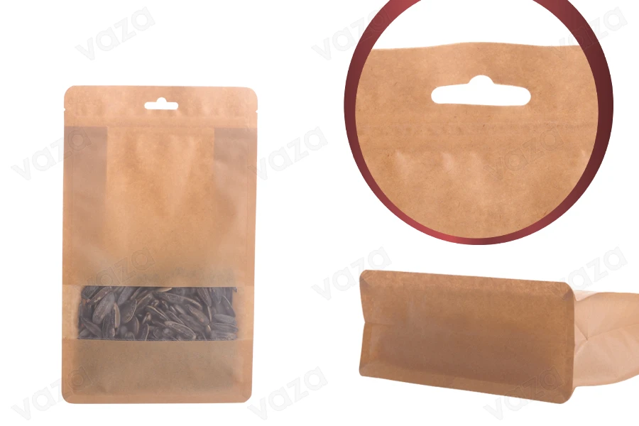 Qese kraft tip “Doy Pack”, me mbyllje “zip”, dritare dhe vrimë Eurohole, veshje të brendshme dhe të jashtme transparente dhe mundësi për vulosje me nxehtësi, 140x60x240 mm – 50 copë. Qese kraft tip “Doy Pack”, me mbyllje “zip”, dritare dhe vrimë Eurohole, veshje të brendshme dhe të jashtme transparente dhe mundësi për vulosje me nxehtësi, 140x60x240 mm – 50 copë.-imazh_produkt