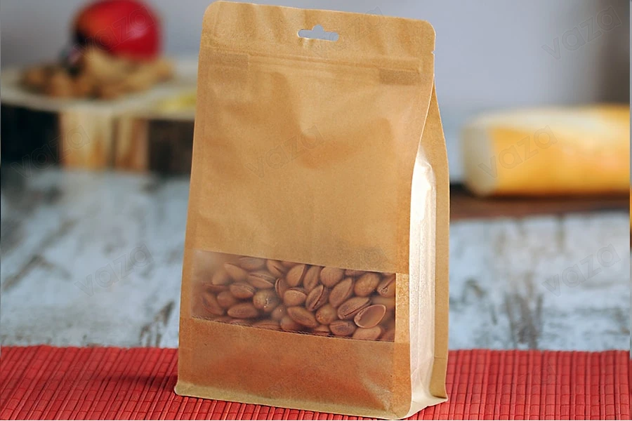 Qese kraft tip “Doy Pack”, me mbyllje “zip”, dritare dhe vrimë Eurohole, veshje të brendshme dhe të jashtme transparente dhe mundësi për vulosje me nxehtësi, 140x60x240 mm – 50 copë. Qese kraft tip “Doy Pack”, me mbyllje “zip”, dritare dhe vrimë Eurohole, veshje të brendshme dhe të jashtme transparente dhe mundësi për vulosje me nxehtësi, 140x60x240 mm – 50 copë.-imazh_grup