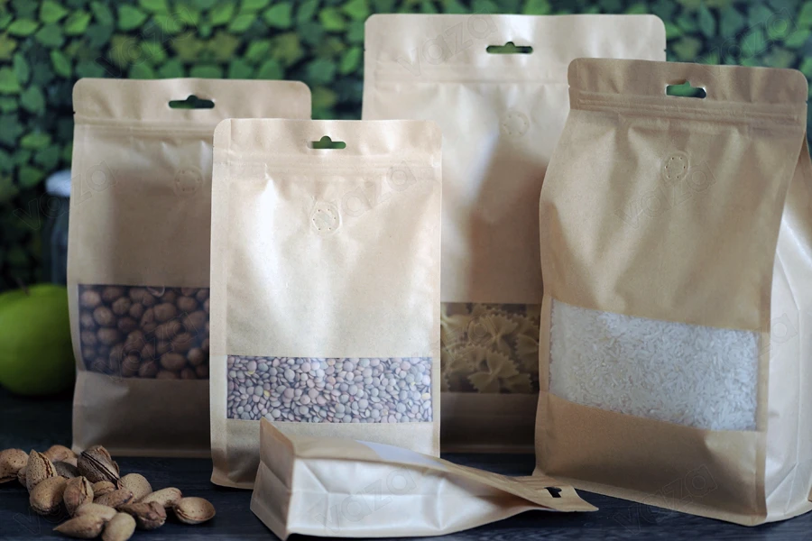 Doypack stand-up pouches kraft with a zipper, valve, window and Eurohole, with a transparent inside and outside layer, also heat sealable, 160x80x260 mm - 25 pcs Doypack stand-up pouches kraft with a zipper, valve, window and Eurohole, with a transparent inside and outside layer, also heat sealable, 160x80x260 mm - 25 pcs-εικόνα_σύνθεση
