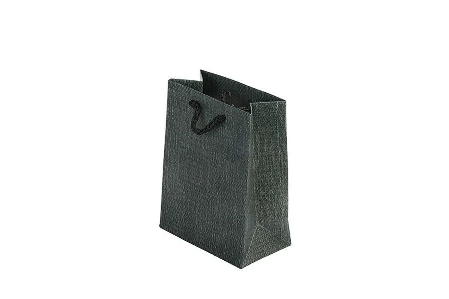 Paper gift bag with handle in many different colours in size 110x60x140 mm Paper gift bag with handle in many different colours in size 110x60x140 mm