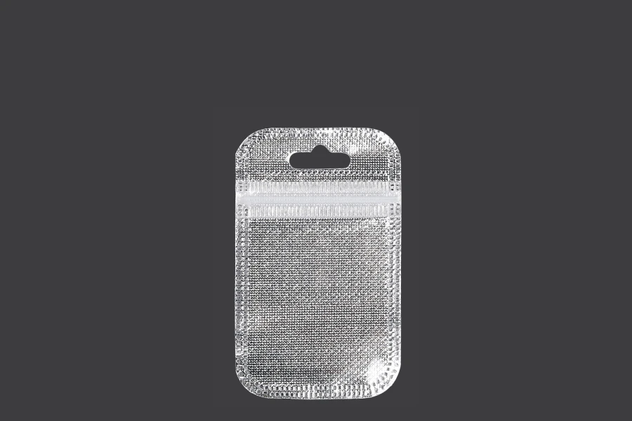 Sachets avec fermeture éclair 55 x 90 mm, dos argenté non tissé, face transparente et eurohole - 100 pcs Sachets avec fermeture éclair 55 x 90 mm, dos argenté non tissé, face transparente et eurohole - 100 pcs