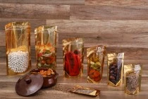 Σακουλάκια τύπου Doy Pack 100x30x180 mm αλουμινίου με χρυσή πίσω πλευρά, διάφανο μπροστά με κλείσιμο "zip" και δυνατότητα σφράγισης με θερμοκόλληση - 100 τμχ