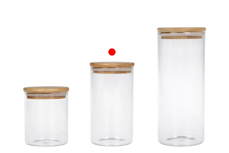 Βαζάκι γυάλινο 700 ml, στρογγυλό με ξύλινο καπάκι και λάστιχο Βαζάκι γυάλινο 700 ml, στρογγυλό με ξύλινο καπάκι και λάστιχο