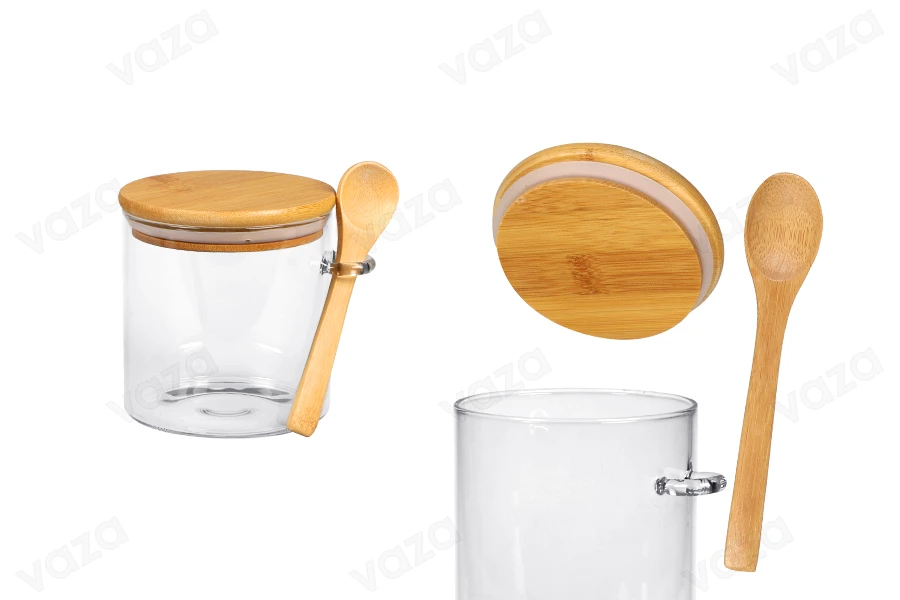 Βαζάκι 600 ml γυάλινο, στρογγυλό 100x100 mm με κουταλάκι και ξύλινο καπάκι Βαζάκι 600 ml γυάλινο, στρογγυλό 100x100 mm με κουταλάκι και ξύλινο καπάκι-εικόνα_προϊοντική