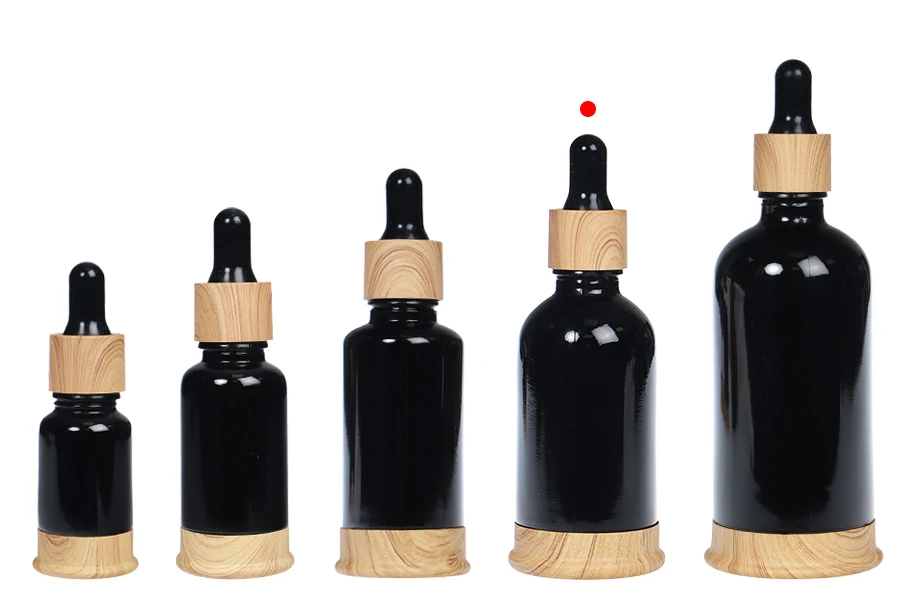 Μπουκαλάκι γυάλινο 50 ml μαύρο με πλαστικό σταγονομετρητή και βάση σε σχέδιο ξύλου Μπουκαλάκι γυάλινο 50 ml μαύρο με πλαστικό σταγονομετρητή και βάση σε σχέδιο ξύλου