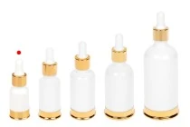 Μπουκαλάκι γυάλινο 10 ml λευκό με πλαστικό σταγονομετρητή και χρυσή βάση αλουμινίου Μπουκαλάκι γυάλινο 10 ml λευκό με πλαστικό σταγονομετρητή και χρυσή βάση αλουμινίου