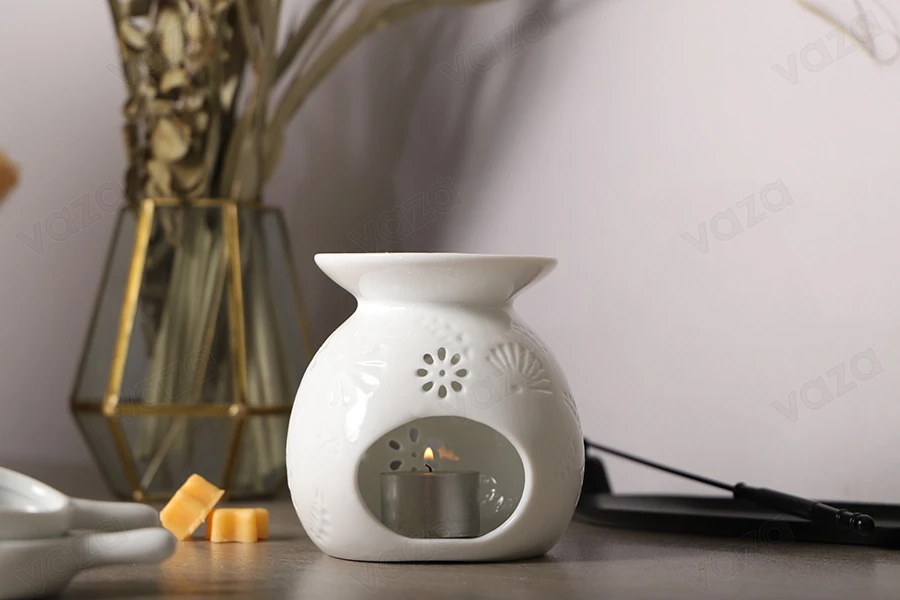Bruciatore in ceramica di colore bianco per cialde di cera e oli-gruppo_immagini