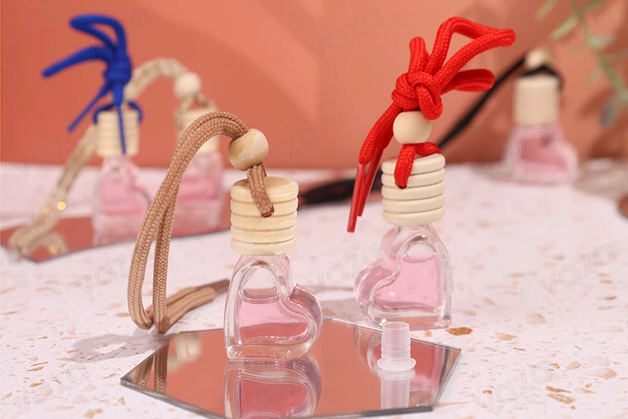 Shishe qelqi 4 ml në formë zemre për aromatizues makinash, me kapak druri dhe tapë – paketim me 25 copë.   -imazh_grup