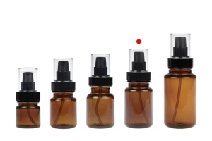Bouteille cylindrique en plastique de 100 ml avec pompe à crème noire et bouchon transparent-photo_groupe
