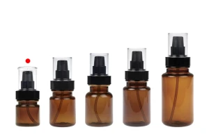 Bouteille cylindrique en plastique de 40 ml avec pompe à crème noire et bouchon transparent.-photo_groupe