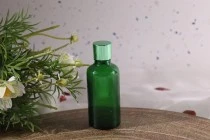 Γυάλινο μπουκαλάκι για αιθέρια έλαια 50 ml πράσινο με στόμιο PP18