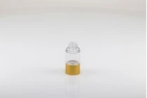 Μπουκάλι airless για κρέμα 15 ml με πλαστικό, διάφανο σώμα, καπάκι και βάση αλουμινίου σε χρυσό ΜΑΤ