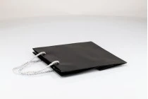 Black laminated gift bag with silver twisted rope handle in size 220x90x210 Black laminated gift bag with silver twisted rope handle in size 220x90x210