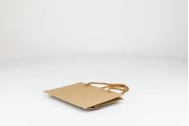 Eco kraft paper gift bag with cotton rope handle in size 190x60x130 Eco kraft paper gift bag with cotton rope handle in size 190x60x130