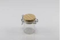 Βάζο 40 ml γυάλινο στρογγυλό 64x45 mm με ξύλινο καπάκι και αεροστεγές κλείσιμο (σύρμα και λάστιχο στο καπάκι)