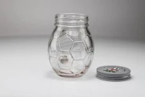 Glass Jar 450 ml football shaped 126x94 mm with silver cap Glass Jar 450 ml football shaped 126x94 mm with silver cap